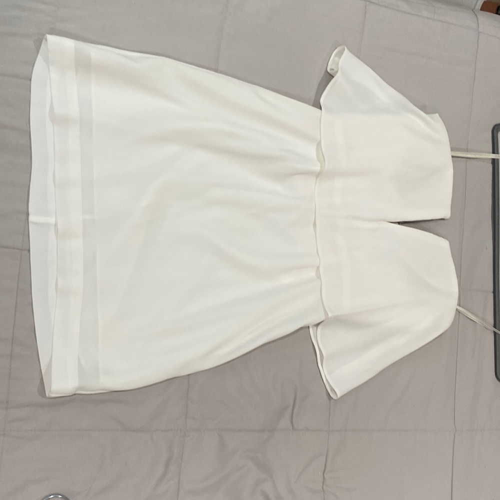 BCBG Maxazria white mid thigh dress size 0 slip down 2 inch slip in front.